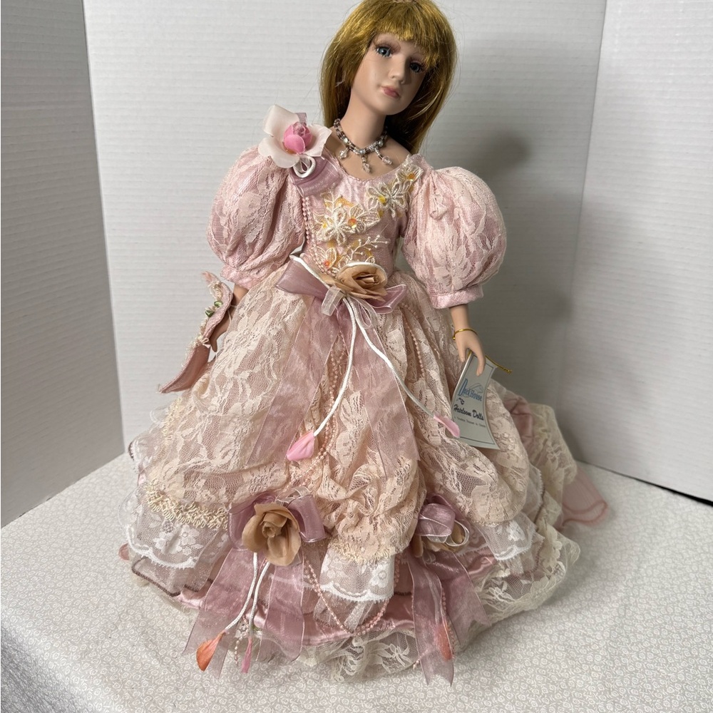 Duck House porcelain doll 17” lace ruffle dress beaded necklace comes with stand